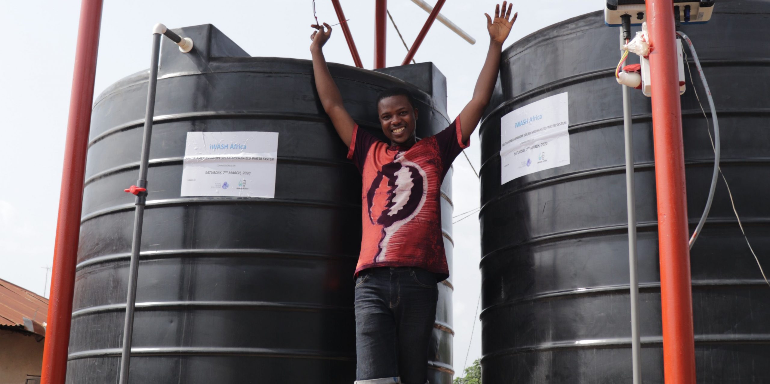 Fellow Jacob Amengor from Ghana inaugurates water kiosk