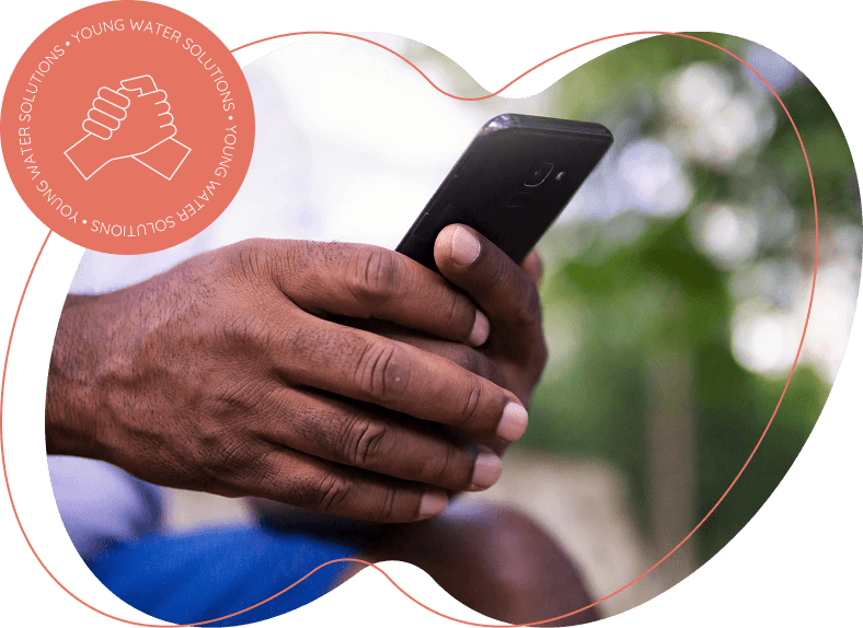 Hands of a Black man holding a phone.